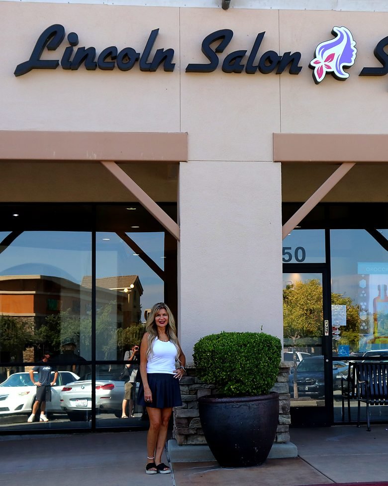 Cindy outside the Lincoln Salon & Spa storefront
