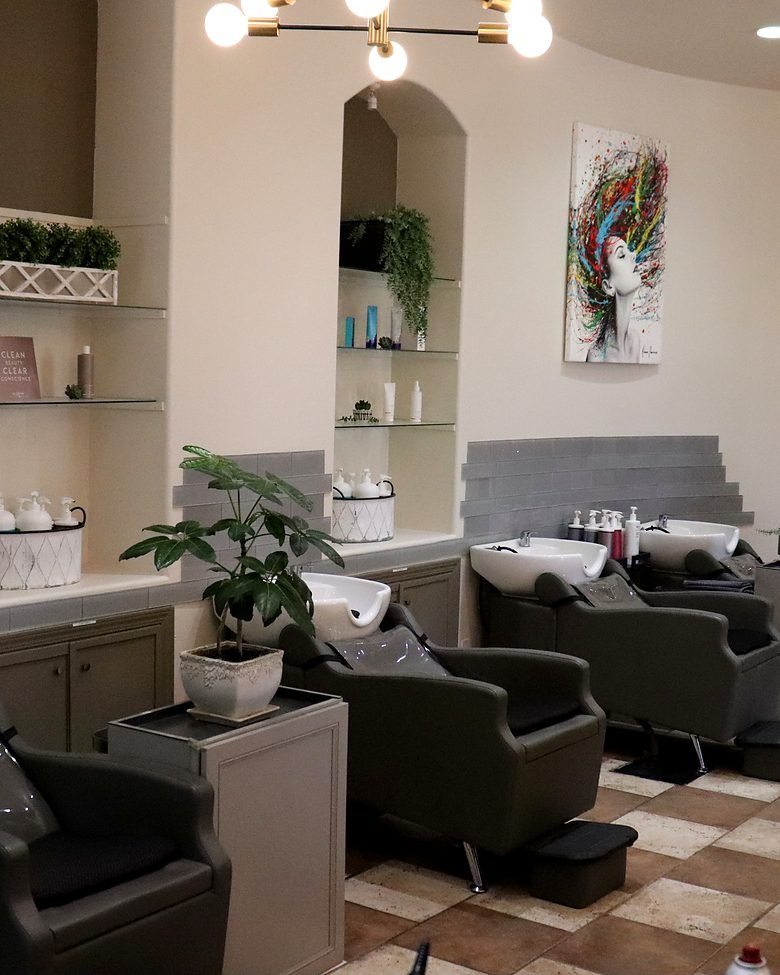 Wash chairs and basins beneath the salon's arched alcoves